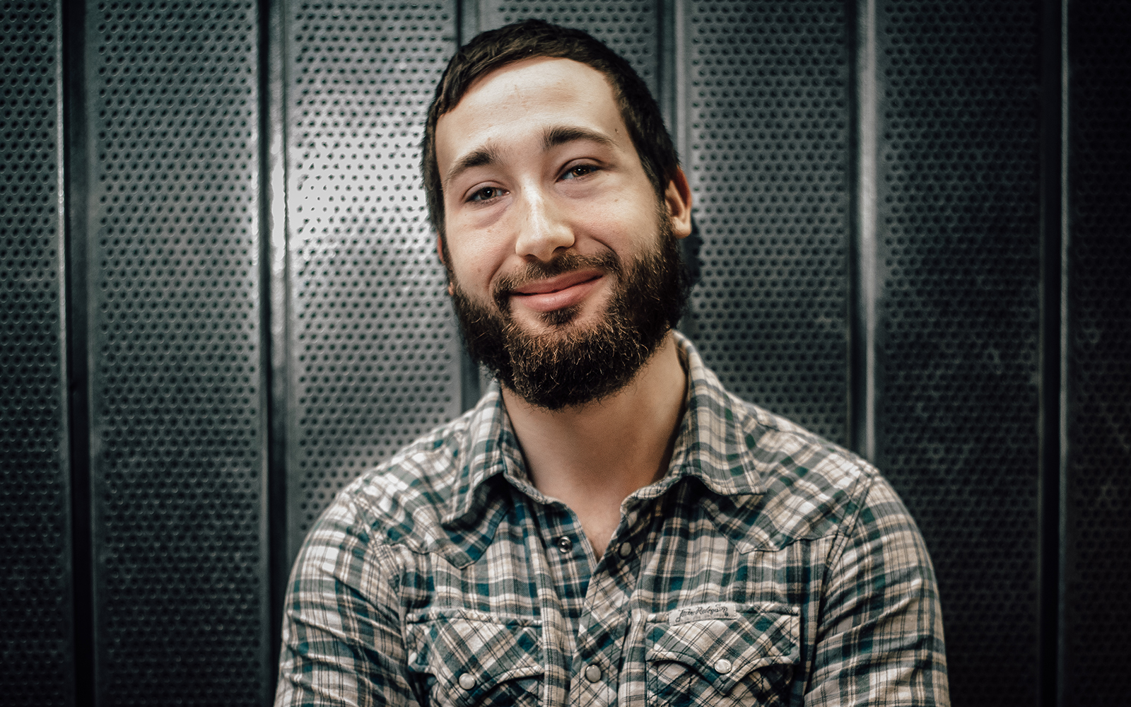 Alex Podgorski, a sophomore majoring in electrical engineering and computer science, said he wants to create a unified, contactless charging device that can’t short-circuit if it gets wet. (Devin Basdekian/UConn School of Business)