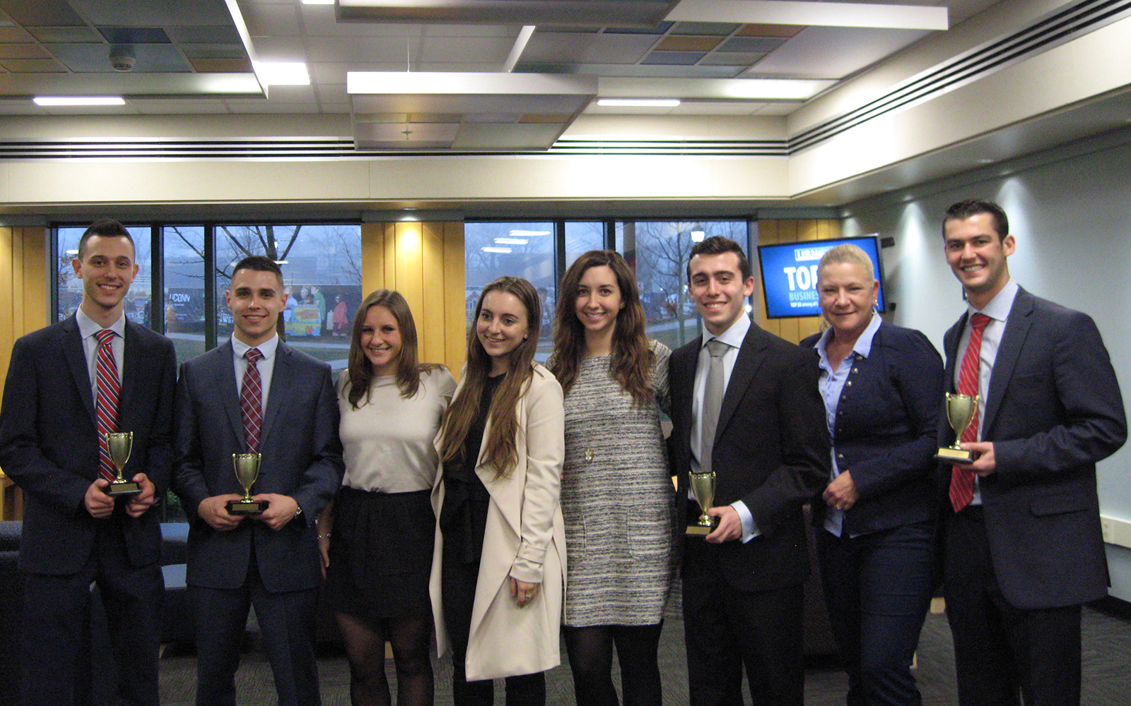 The four winning students with Kathleen Halligan, Grace Nardella, Victoria Gitelman, and Karen Narciso from Altria (Seanice Austin/UConn School of Business)