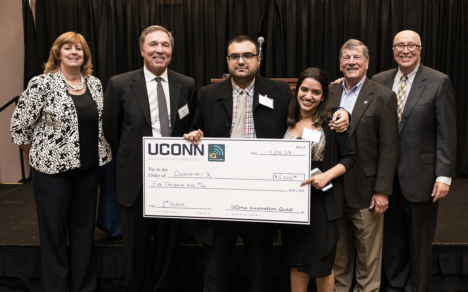From left: Management Department Head Lucy Gilson, Alumnus Keith Fox ’80, Dermatat-X team members Faizan Khan and Ishita Banerjee, School of Business Dean John Elliott, and Management Professor Rich Dino (Nathan Oldham/UConn School of Business)
