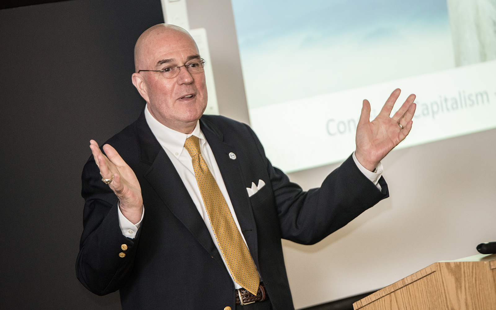 Larry Bingaman, president and chief executive officer of the South Central Connecticut Regional Water Authority, speaks to students about conscious capitalism. (Nathan Oldham/UConn School of Business)