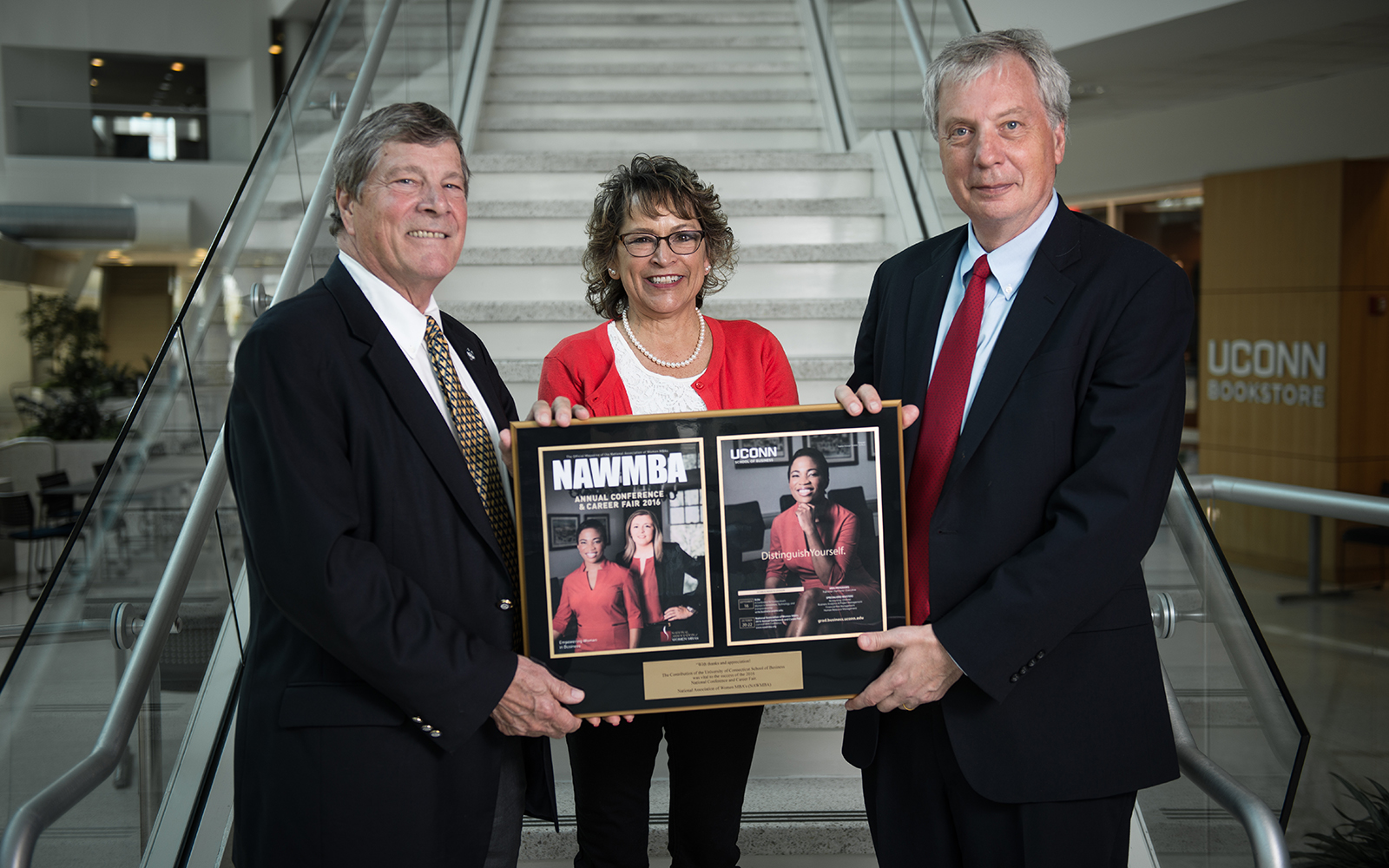 NAWMBA plaque presented to John Elliott, Marlys Rizzi, John Knopf (Nathan Oldham/UConn School of Business)