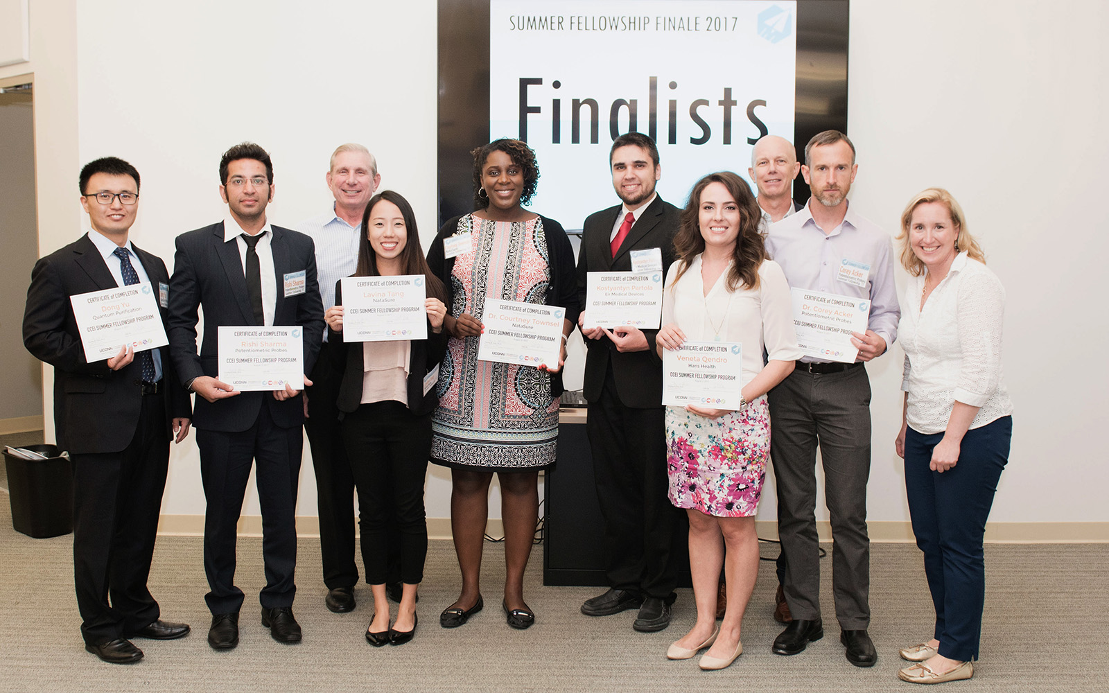From left, Dong Yu, Quantum Purification; Rishi Sharma, Potentiometric Probes; Greg Wolff '75 (ED), Lavina Tang, NataSure; Dr. Courtney Townsel, NataSure; Kostyantyn Partola, Eir Medical Devices; Veneta Qendro, Hans Health; Professor Timothy B. Folta, UConn School of Business; Dr. Corey Acker, Potentiometric Probes; and Michelle Cote, UConn School of Business. (Jennifer Murphy/UConn School of Business)