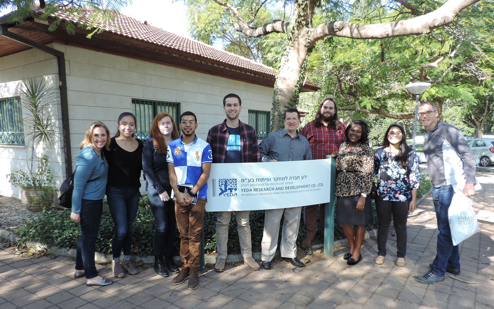 UConn students in front of Yeda Research and Development Co. Ltd, the technology transfer company of the Weizmann Institute of Science in Rehovot, Israel. (Steven Jenkins/UConn photo)