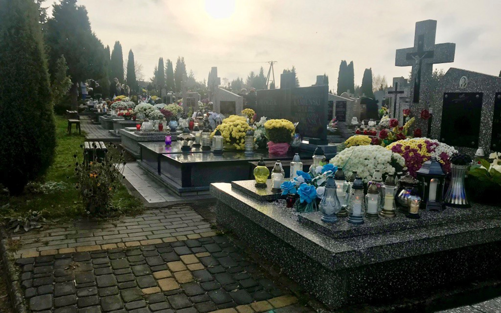 Candles and bouquets at a Cemetery on All Saints Day in Lomza, Poland (Kasia Kolc / UConn School of Business)
