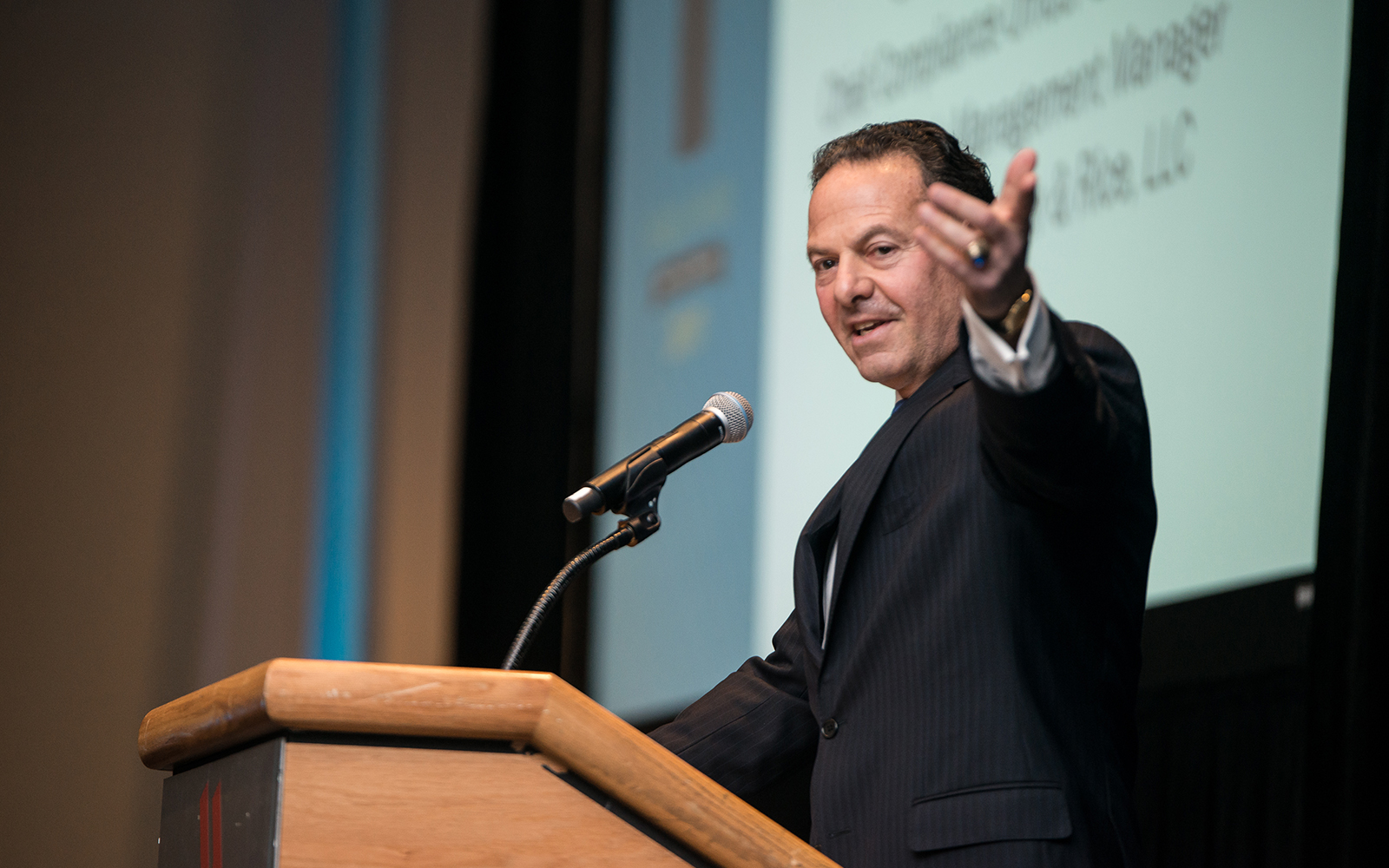 John Malfettone '77 (BUS) speaks about the importance of giving back to your alma mater, on the occasion of his induction into the School of Business Hall of Fame in 2017. (Nathan Oldham/UConn Photo)