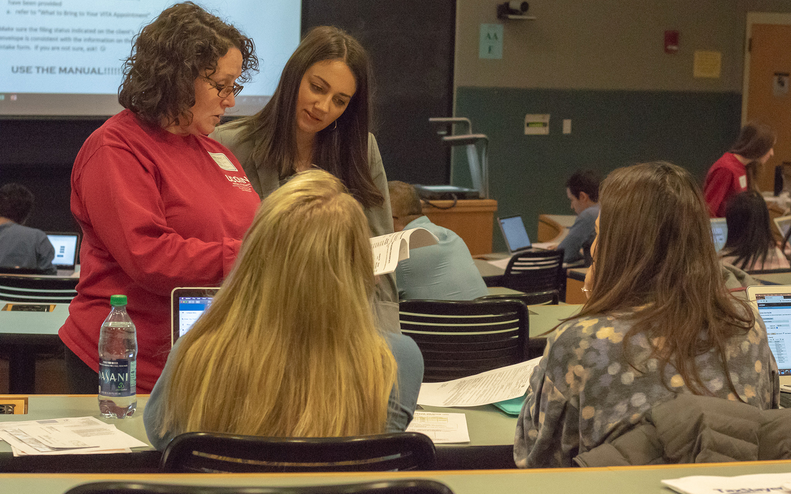 Professor Adams (left) discusses the application of income tax treaties with Emily Boushee '14, Outreach Assistant for U.S. Sen. Chris Murphy, who recently visited to learn more about the program. (Leanne Adams / UConn School of Business)