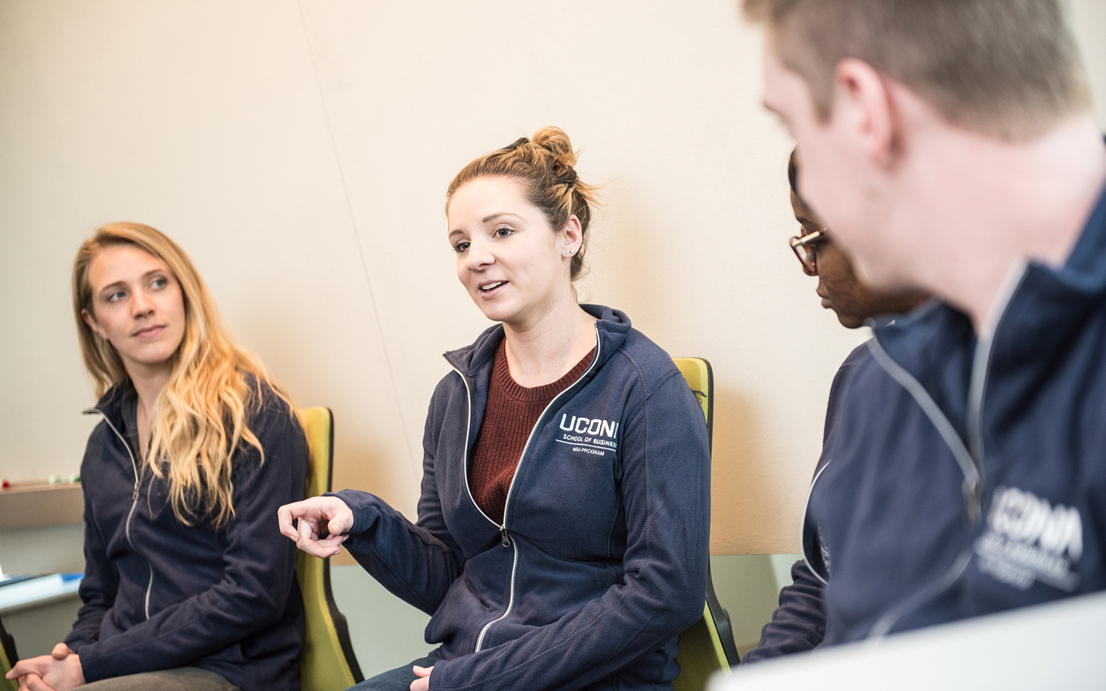 UConn Full-time MBA students share wisdom and advice during a visit with young adults from local nonprofit group Our Piece of the Pie.  Left to right: Shelby Iapoce-Lintz, Maria Cebula, Lucy Adjei, Michael Keating (Nathan Oldham / UConn School of Business)