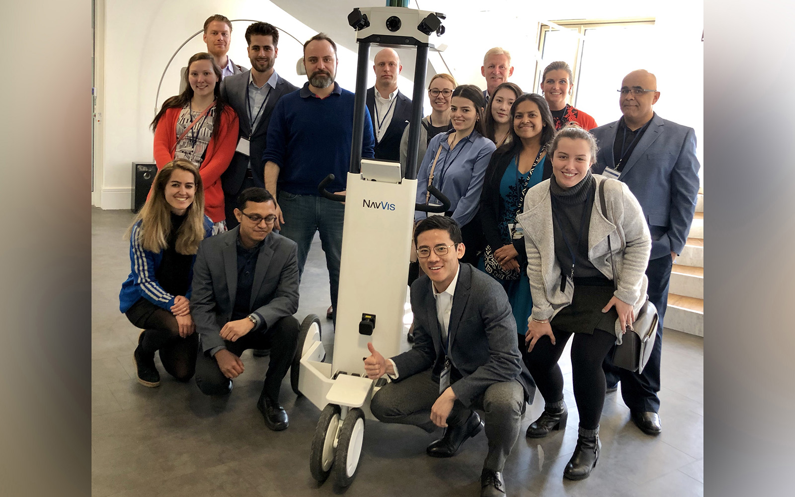 Graduate students, most from the MSBAPM program, visited Munich last month to expand their knowledge of international business. Pictured above, the students gather around a mobile indoor mapping system. (Contributed Photo)