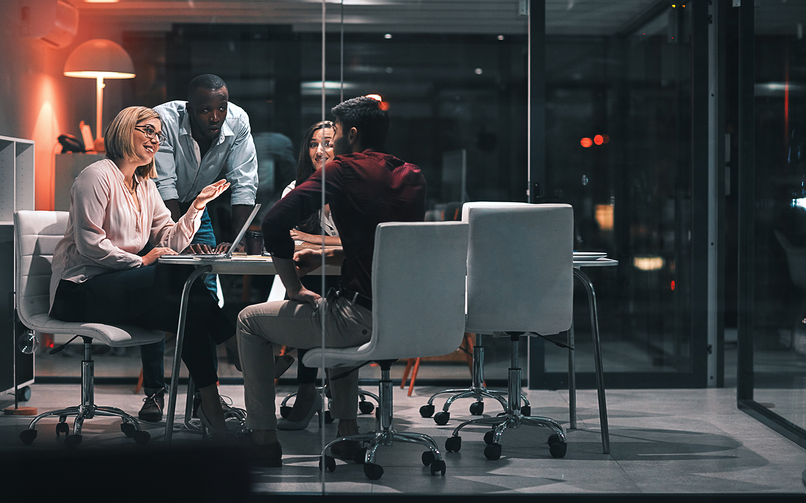 Shot of colleagues having a meeting during a late night in a modern office