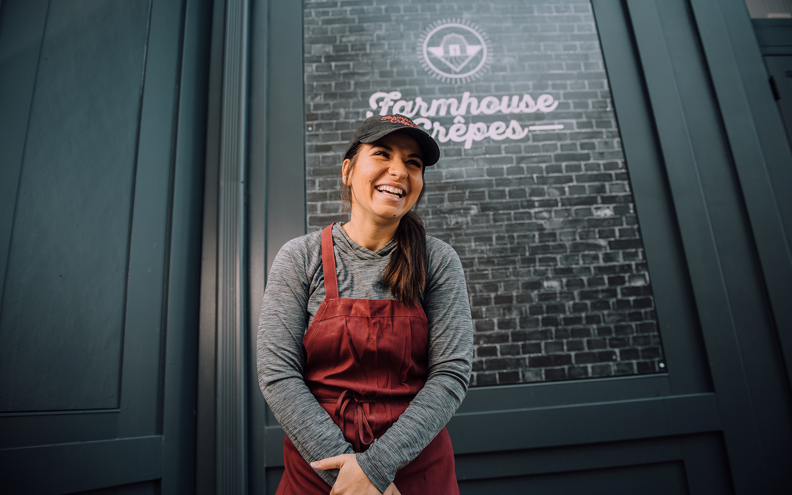 Ashley DeCarlo smiling outside of Farmhouse Crepes