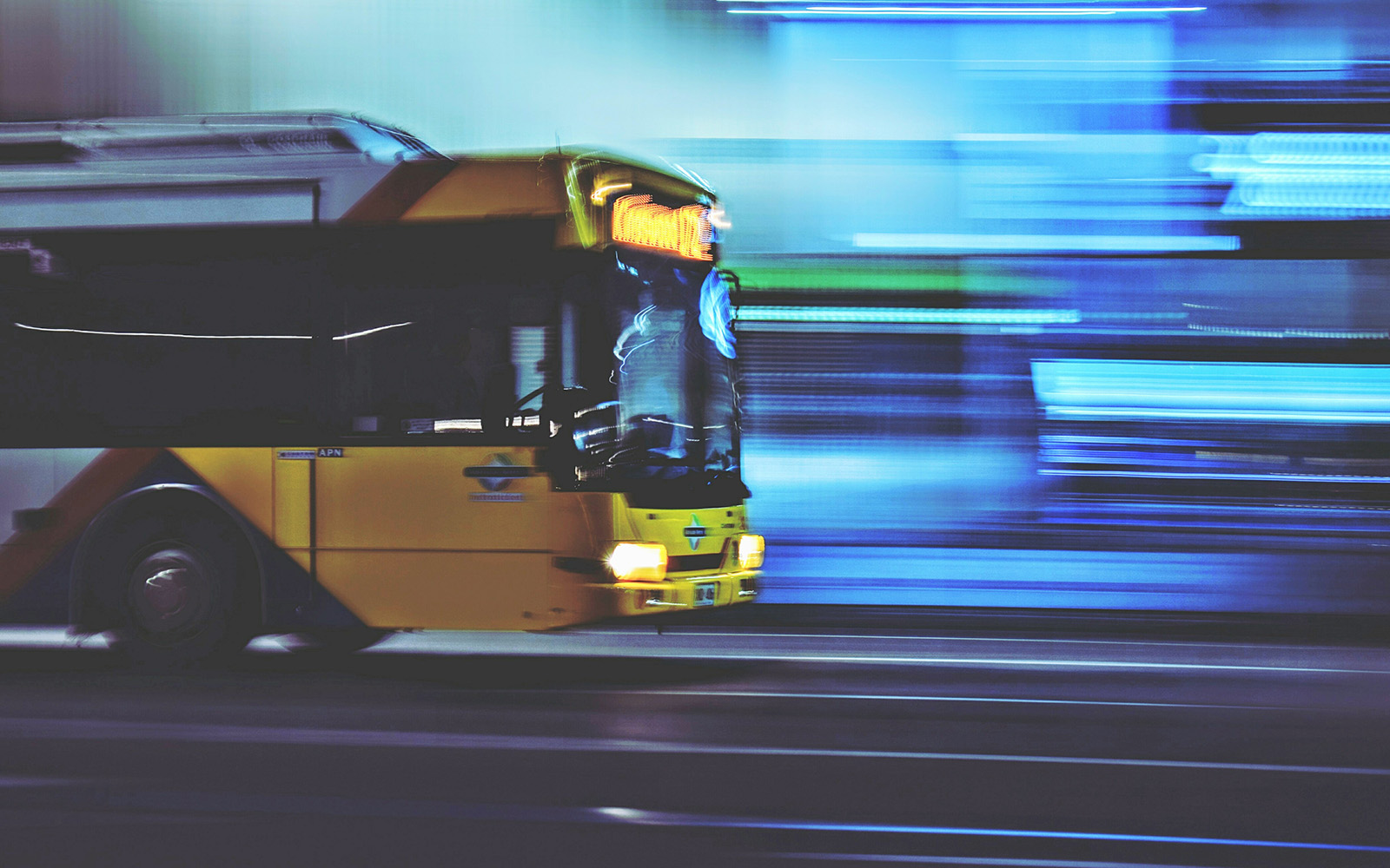 Blurred Motion Of Bus On Road At Night
