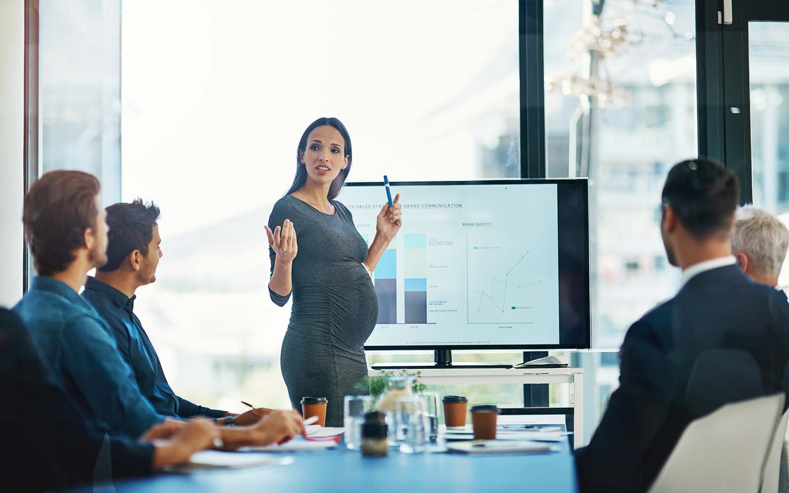 Cropped shot of a pregnant businesswoman giving a presentation in the boardroom