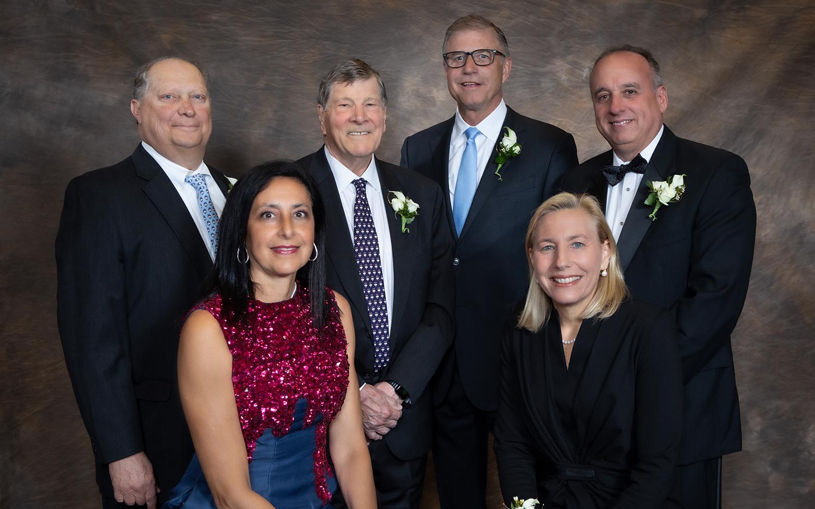 The newest inductees of the School of Business's Hall of Fame pose with Dean John A. Elliott. Back row, left to right: Nicholas Morizio, Dean John Elliott, Richard Eldh,   Richard Tavolieri.  Front row, left to right: Noha Carrington, Joanne Crevoiserat. (Thomas Hurlbut Photography / UConn School of Business)