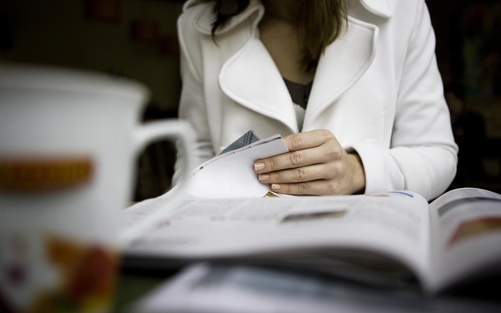 "Woman reading newspaper, canon 1Ds mark III"