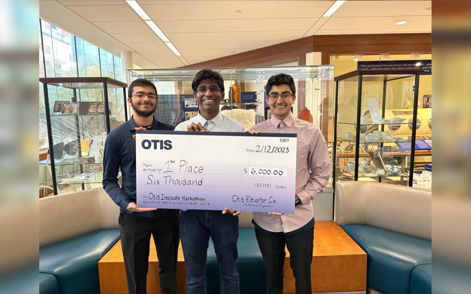 Left to Right: Aditya Chandraker, Niteesh Saravanan, and Priyanshu Agrawal hold their prize at the Otis Hackathon in Storrs. (Contributed Photo)