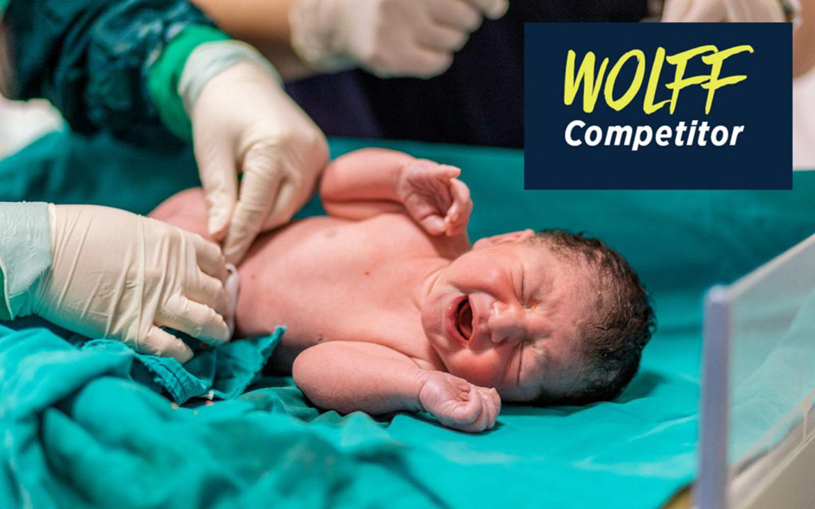 A doctor tends to a newborn infant.